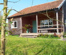 This stud frame house has timber cladding, but conventional roofing tiles;