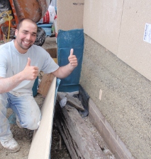 Removing the shuttering to expose a raw hempcrete wall