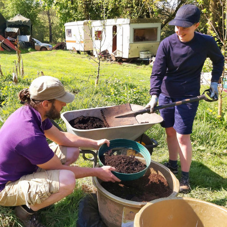 Creating tilth for growing carrots in tubs.