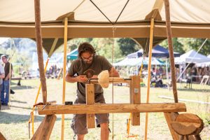 Turning a bowl on a lathe at the Bowl Gathering