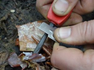 Demonstrating how to use a firesteel