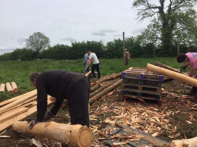 Working on the roundhouse build at The Community Farm