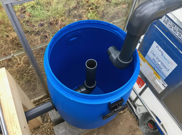 The DIY swirl filter in the aquaponics greenhouse