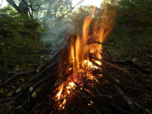 A campfire is essential but can be harder to achieve when camping in winter