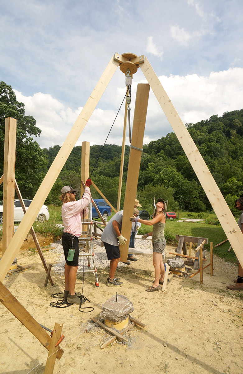 Using the tripod hoist to lift and position oak timbers