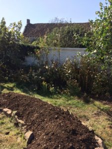 Composting outdoors using hugelkultur