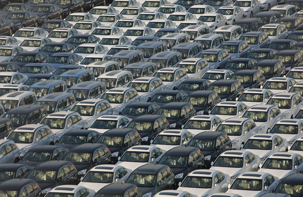 In a perpetually-growing economy, what will limit the number of cars in the world?