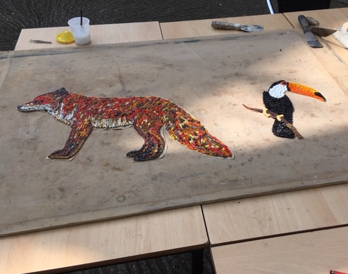 Mosaics depicting a fox and a toucan