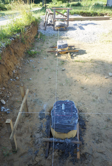 String lines are essential for precisely positioning the stone plinths and using as a reference for post positions