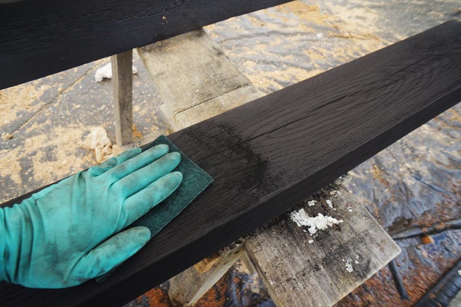 Buffing the charred wood