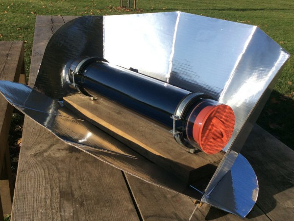 This solar kitchen comes with a pot and a solar-cooking device