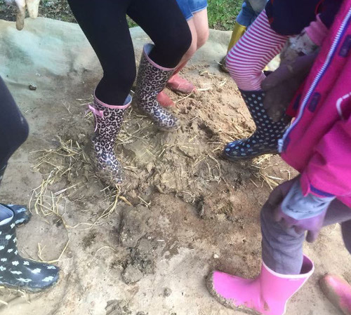 Mixing clay and straw for daub.